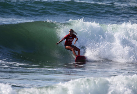 MEREWETHER AUSTRALIA - FEBRUARY 17: Elle-jean Coffey from Australia surfing in the Burton Toyato Pro Junior professional surfing event at Merewether Beach. Feb. 17, 2013 Merewether, Australia.のeditorial素材