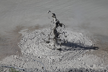 A erruption of gas in a mud pool in the thermal region of Rotarua New Zealand の写真素材