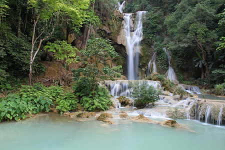 A  waterfall at the Kuang Si Falls outside of Luang Prabang. These waterfalls and cascades are a popular place for tourists and locals to visit to cool off.  Luang Prabang - Laosの写真素材