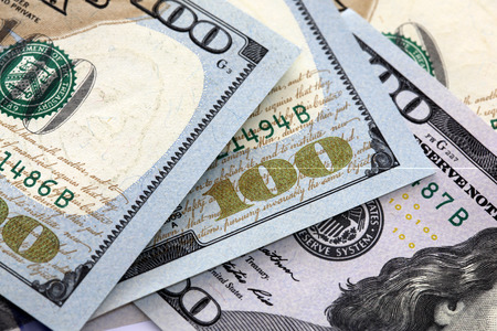 American one hundred dollar notes. Shallow depth of field focus  Detailed shot with no complete notes shown.の写真素材