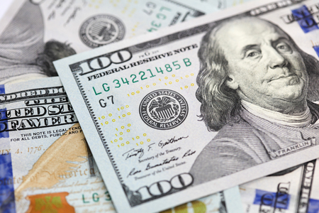 A closeup of United States of an American 100 dollar notes featuring Benjamin Franklin.の写真素材