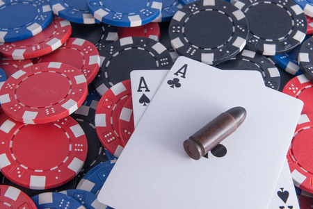 black aces poker and chips center close up bullet gun right centerの写真素材