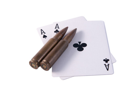two aces black and two rifle bullets isolated white right
