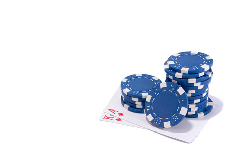 blue poker chips and poker ace and king cards isolated white