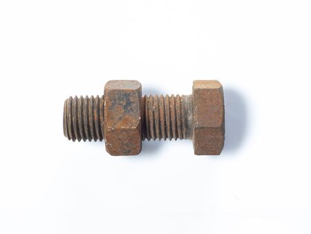 Close-up of rusty nut and bolt isolated on white backgroundの写真素材