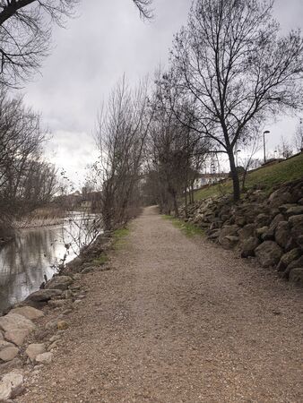 Running path next to the river in a city park. Concept of healthの写真素材