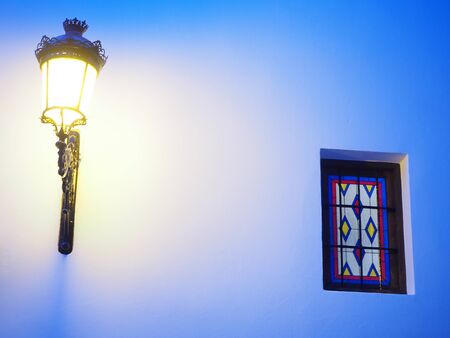 lantern on a facade of an old church at sunset. Travel conceptの写真素材