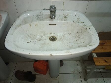 Old disgusting dirty colourful drain in ancient industryの写真素材