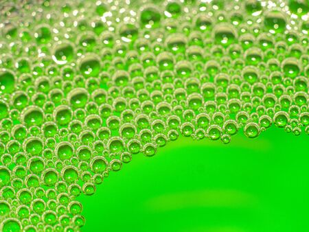 Neon green liquid pumps. Abstract backgroundの写真素材