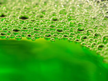 Neon green liquid pumps. Abstract backgroundの写真素材