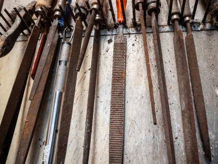 Lots of old rusty tools in an old garageの写真素材