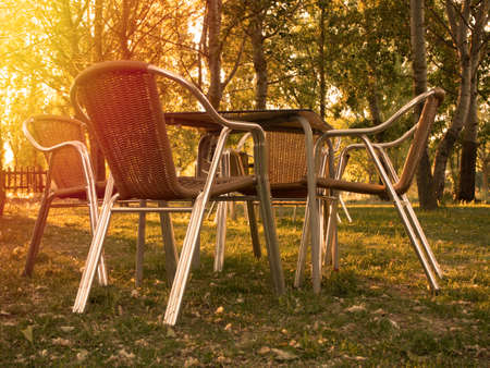 Chairs and tables stacked in a closed nature cafe. High quality photoの写真素材
