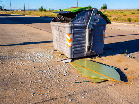 Green garbage containers in the city streetの写真素材