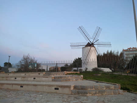 white windmill in europe at sunset. Travel concept. High quality photoの写真素材
