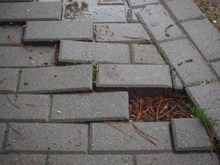 broken concrete pathway brick surface background, close up abstract cracked cement block texture