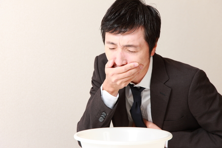 vomiting businessmanの写真素材