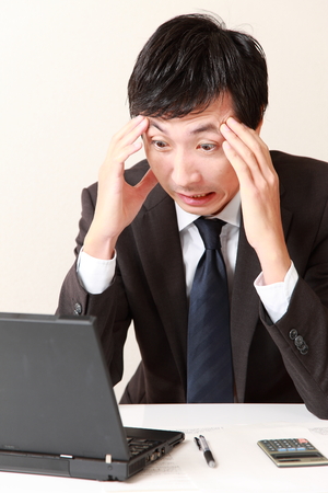 panicking businessmanの写真素材