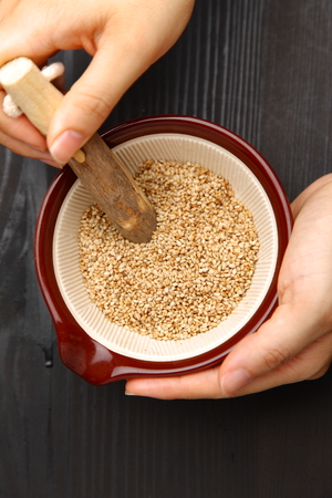 white sesame seed in Japanese mortarの写真素材