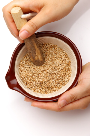 white sesame seed in Japanese mortarの写真素材