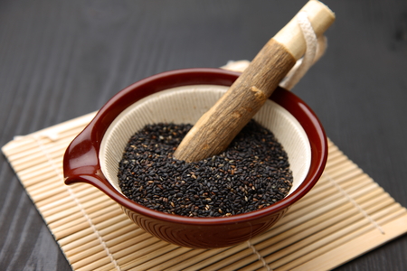 Black sesame seed in Japanese mortarの写真素材