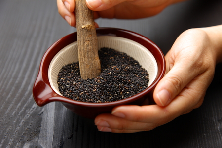 Black sesame seed in Japanese mortarの写真素材