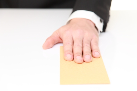 businessman submits an envelope