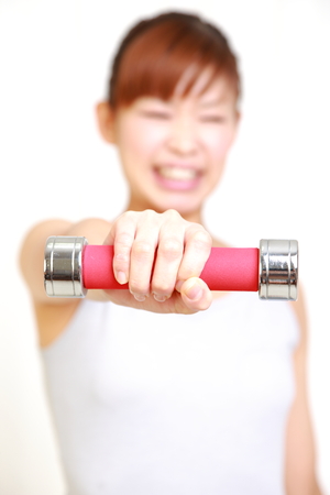 woman doing dumbbell exerciseの写真素材