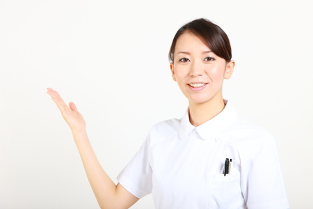 young Japanese nurse explainsの写真素材