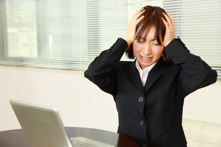 panicking businesswomanの写真素材