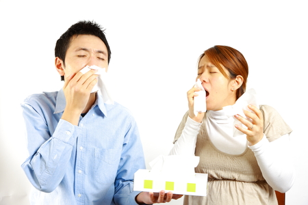 Japanese Couple suffers from allergic rhinitisの写真素材