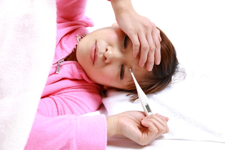 young japanese woman with fever&#12288;の写真素材