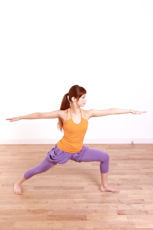 Young Japanese Woman Doing YOGA warrior II poseの写真素材