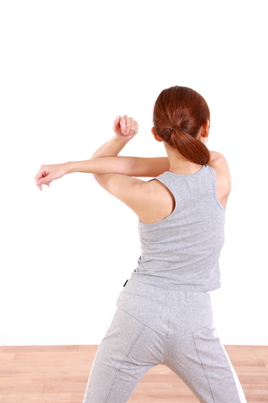young woman doing stretchの写真素材