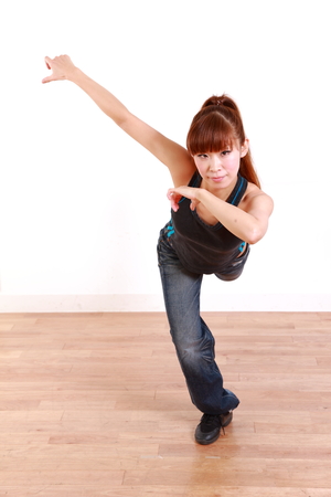 young Japanese woman dancingの写真素材