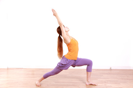 Woman Doing YOGA warrior 1 poseの写真素材