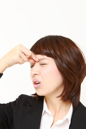 businesswoman suffers from Asthenopiaの写真素材