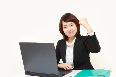 Japanese businesswoman in a victory poseの写真素材