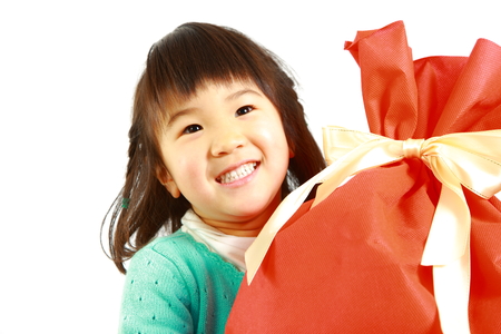 little Japanese girl with large gift&#12288;の写真素材