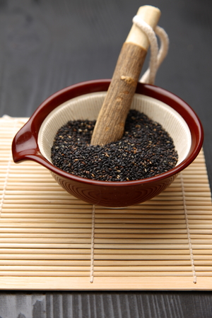 Black sesame seed in Japanese mortarの写真素材