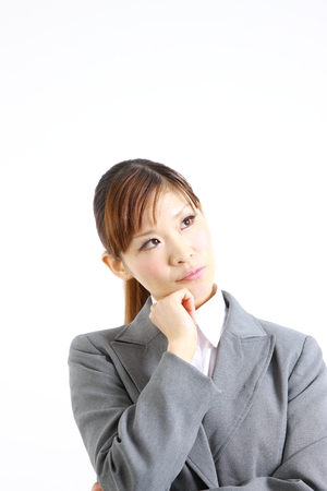 Japanese businesswoman thinks about somethingの写真素材