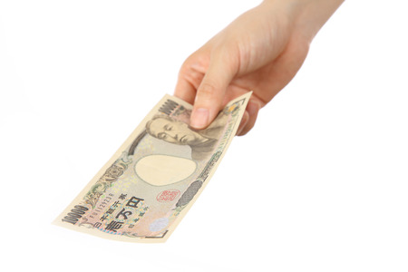pay a Japanese 10000YEN billの写真素材