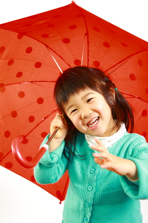 little Japanese girl with an umbrellaの写真素材