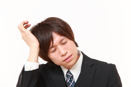 businessman suffers from headacheの写真素材