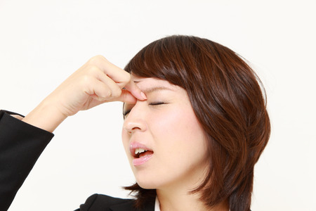 businesswoman suffers from Asthenopiaの写真素材