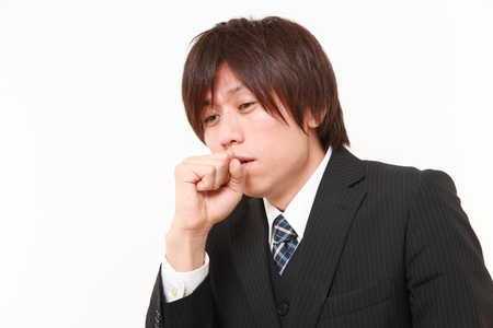 coughing businessmanの写真素材