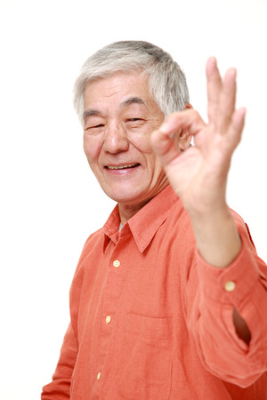 senior Japanese man showing perfect signの写真素材