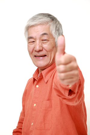 senior Japanese man with thumbs up gestureの写真素材