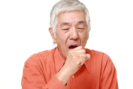 senior Japanese man coughingの写真素材