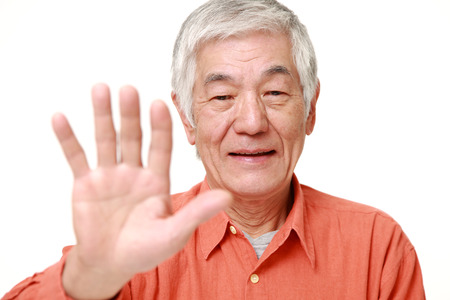 senior Japanese man making stop gestureの写真素材