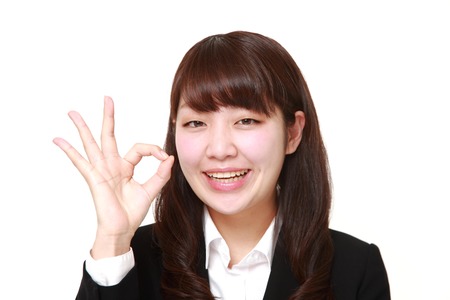 businesswoman showing perfect signの写真素材